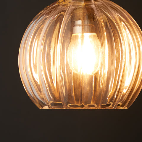 a glass pumpkin pendant light