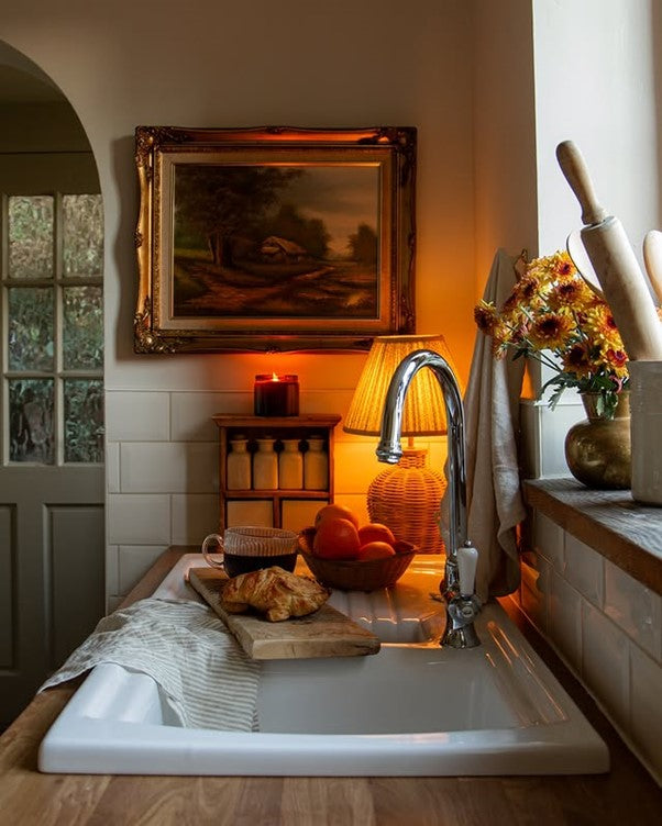 rattan table lamp in a kitchen next to a sink
